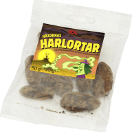En genomskinlig plastpåse innehåller några mörka bitar och har en etikett med texten 