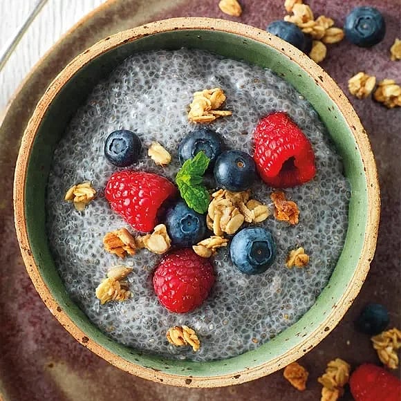 Chia pudding topped with berries and granola
