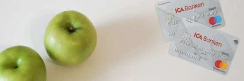 Två bankkort och två äpplen