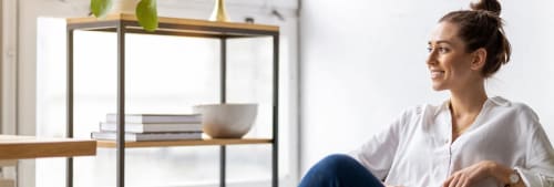 Woman looking towards a window