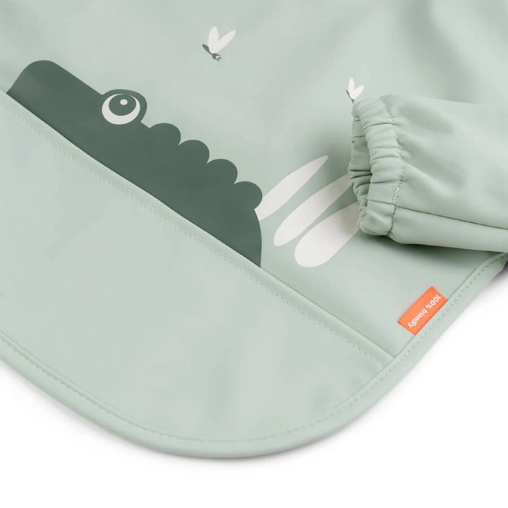 Done by Deer Sleeved Pocket Bib Croco Green Done by Deer