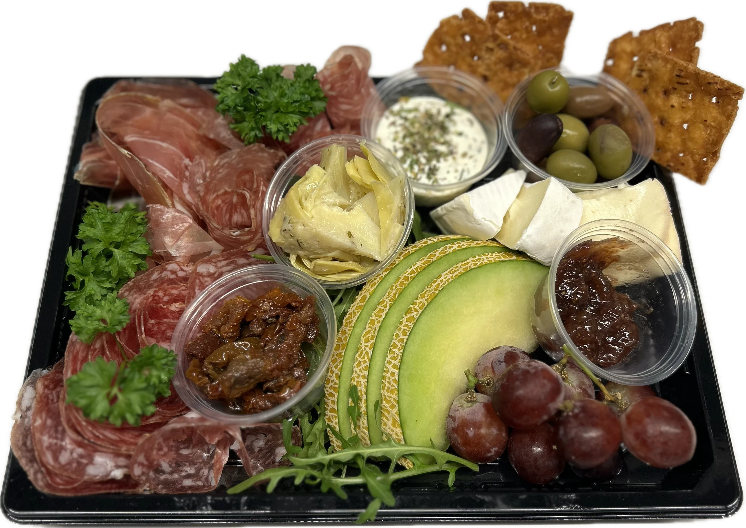 Vårt tapasfat med lufttorkad skinka, frukt och kex.