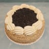 Sockerkaksbotten, drottningsylt, vaniljkräm, grädde, blåbär eller hallon, krokantströssel (puffat ris).