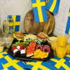 Studentfrukost med bl.a. apelsinjuice, yoghurt och browniespett
