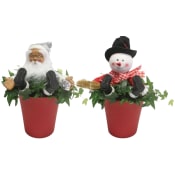 Arrangemang Tomte i hemtrevnad bredd 13cm höjd ca 20cm.