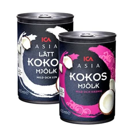 Två burkar kokosmjölk står bredvid varandra på en vit bakgrund.