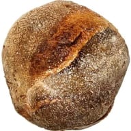 Rund hantverksbrödslimpa Levain med en spricka i skorpan.