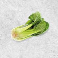 En bok choy ligger på en yta.