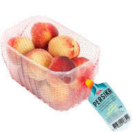 En låda med saftiga persikor