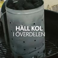 Ett tändrör fyllt med grillkol.