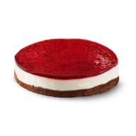 Cheesecake med cream cheese fyllning toppad med hallontäcke.