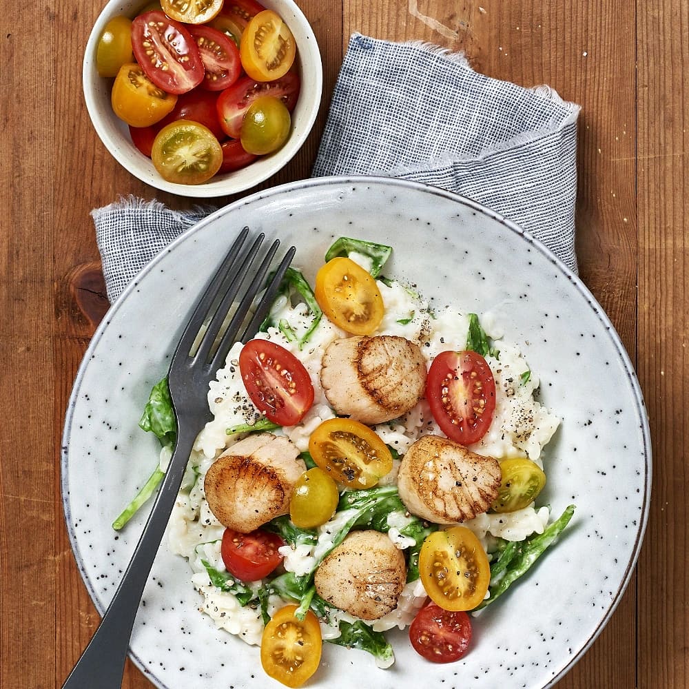 Kammusslor med risotto och spenat